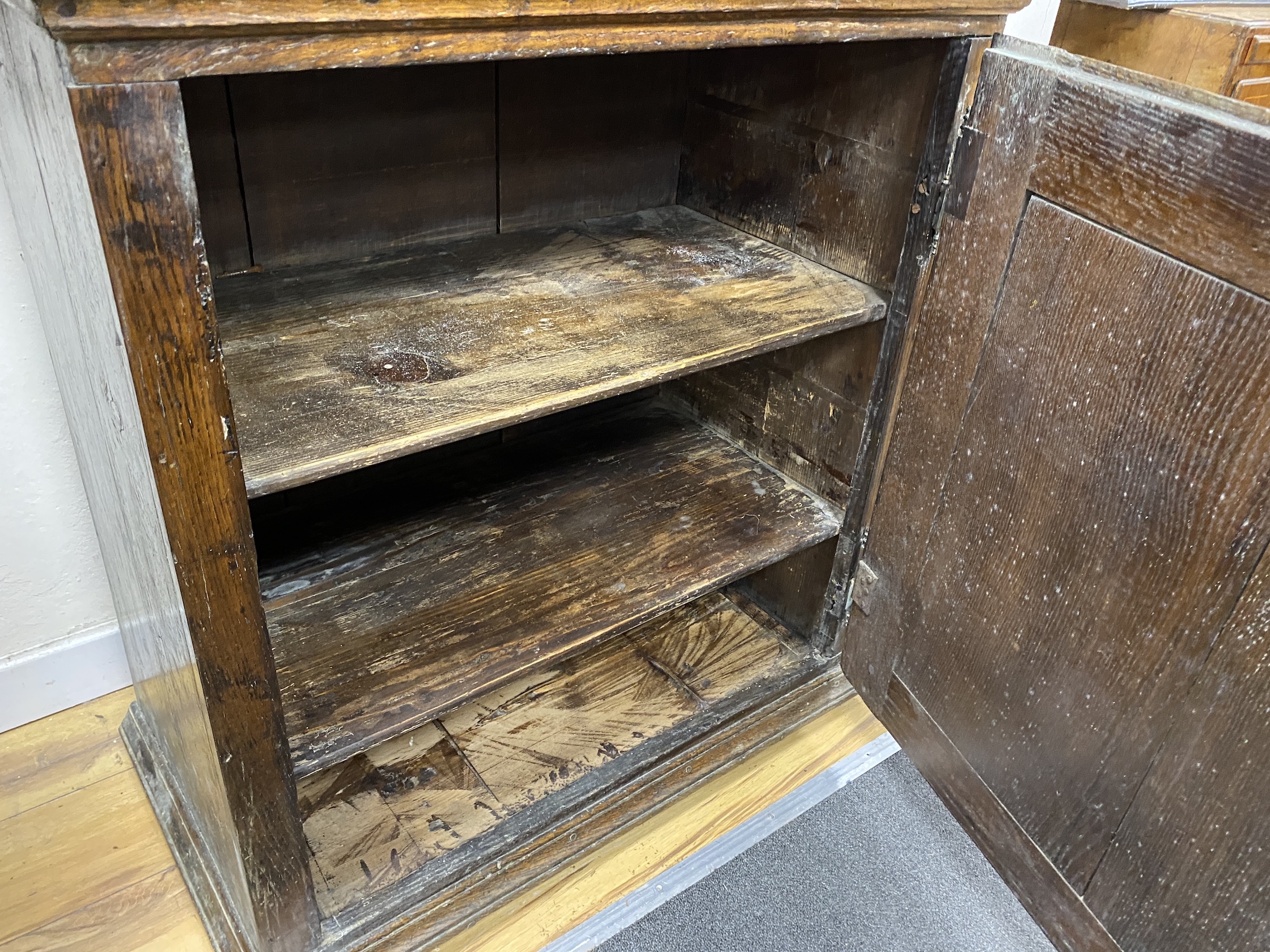 A late 18th / early 19th century Flemish Provincial glazed oak side cabinet, width 81cm, depth 46cm, height 196cm